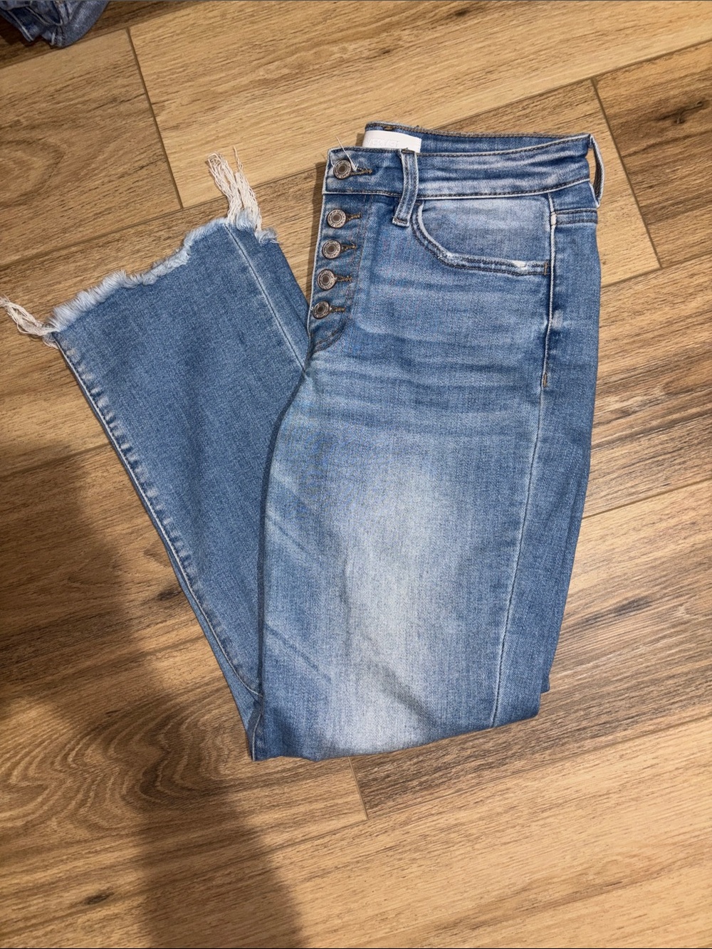 High-Rise Light Blue Cropped Jeans with Button-Fly and Frayed Hem